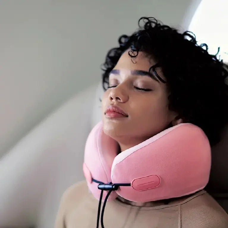 woman using the travel pillow and relaxing while in a flight